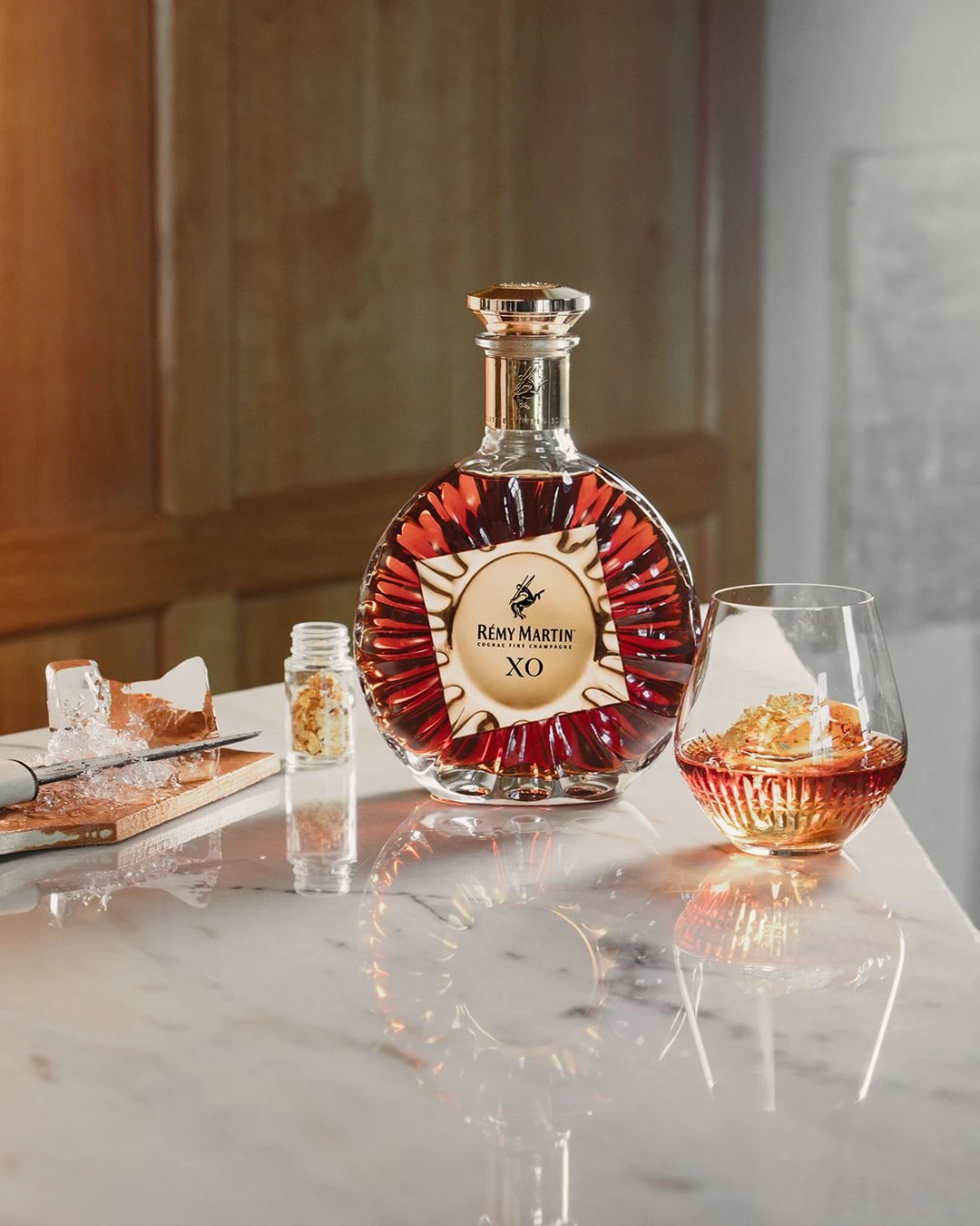 Brandy bottle and tasting glass illustrating fruit character and body