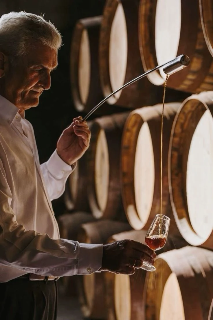 Whisky drawn from a barrel and examined in a cask cellar