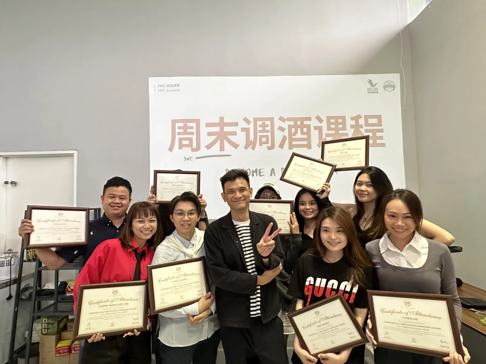 Real JWC mixology students and instructor holding completion certificates